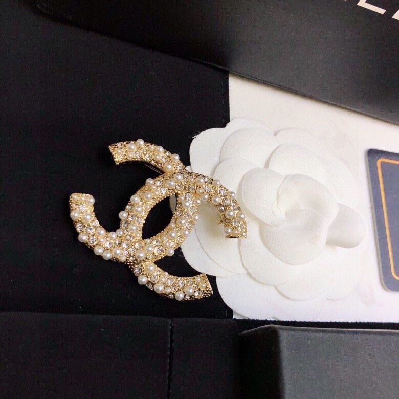 Ch*el brooches